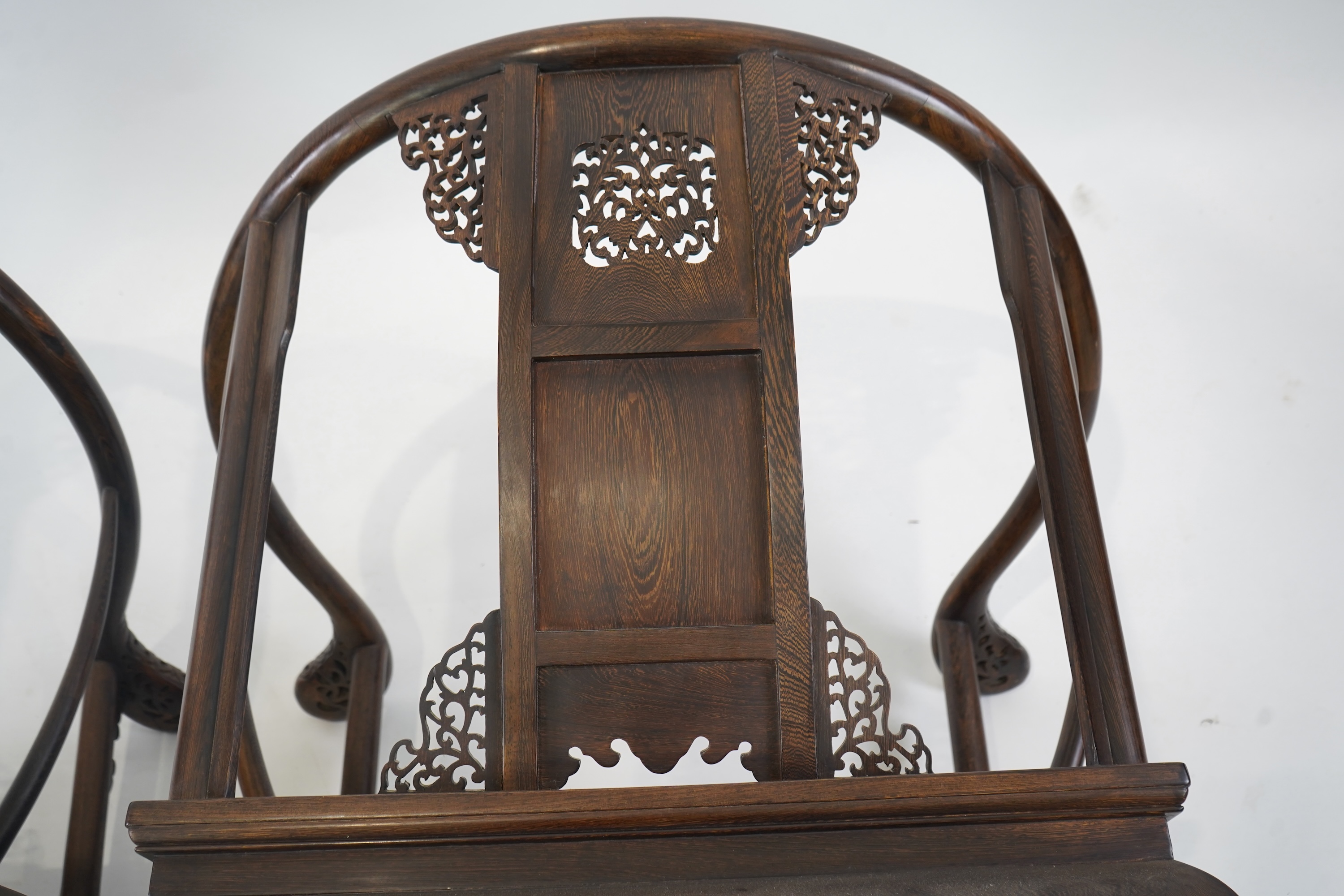A pair of Chinese jichimu horseshoe shaped armchairs and a matching table, 19th/20th century